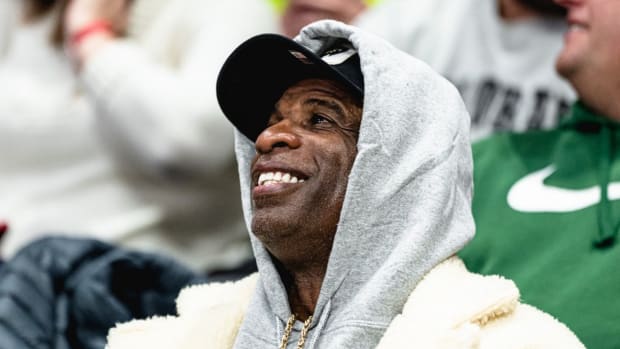 Deion Sanders takes in CU Basketball game on campus